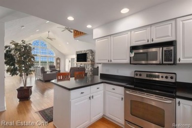 Welcome to 1171 North Shore, an exceptional waterfront property on Duck Lake Country Club in Michigan - for sale on GolfHomes.com, golf home, golf lot