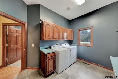 This custom Manzitto home is a jewel of the Pine Lake community! on Pine Lake Golf and Tennis Club in Nebraska - for sale on GolfHomes.com, golf home, golf lot