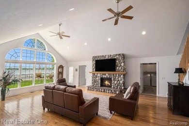 Welcome to 1171 North Shore, an exceptional waterfront property on Duck Lake Country Club in Michigan - for sale on GolfHomes.com, golf home, golf lot
