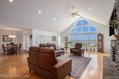 Welcome to 1171 North Shore, an exceptional waterfront property on Duck Lake Country Club in Michigan - for sale on GolfHomes.com, golf home, golf lot
