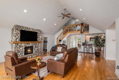 Welcome to 1171 North Shore, an exceptional waterfront property on Duck Lake Country Club in Michigan - for sale on GolfHomes.com, golf home, golf lot