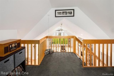 Welcome to 1171 North Shore, an exceptional waterfront property on Duck Lake Country Club in Michigan - for sale on GolfHomes.com, golf home, golf lot