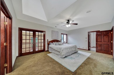 This custom Manzitto home is a jewel of the Pine Lake community! on Pine Lake Golf and Tennis Club in Nebraska - for sale on GolfHomes.com, golf home, golf lot