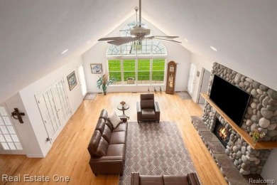 Welcome to 1171 North Shore, an exceptional waterfront property on Duck Lake Country Club in Michigan - for sale on GolfHomes.com, golf home, golf lot