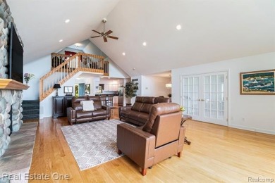 Welcome to 1171 North Shore, an exceptional waterfront property on Duck Lake Country Club in Michigan - for sale on GolfHomes.com, golf home, golf lot
