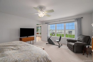 Welcome to 1171 North Shore, an exceptional waterfront property on Duck Lake Country Club in Michigan - for sale on GolfHomes.com, golf home, golf lot