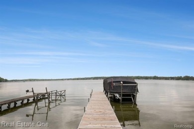 Welcome to 1171 North Shore, an exceptional waterfront property on Duck Lake Country Club in Michigan - for sale on GolfHomes.com, golf home, golf lot
