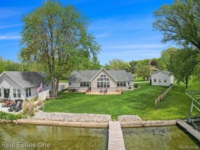 Welcome to 1171 North Shore, an exceptional waterfront property on Duck Lake Country Club in Michigan - for sale on GolfHomes.com, golf home, golf lot