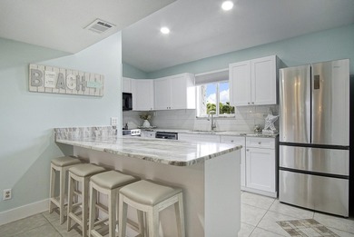 Gorgeous 2 bed, 2 bath, 2nd floor condo overlooking the 8th on Ocean Village Golf Course in Florida - for sale on GolfHomes.com, golf home, golf lot