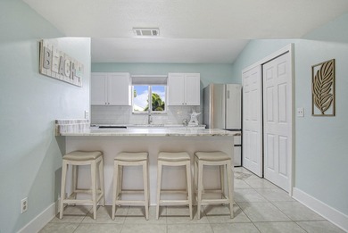 Gorgeous 2 bed, 2 bath, 2nd floor condo overlooking the 8th on Ocean Village Golf Course in Florida - for sale on GolfHomes.com, golf home, golf lot