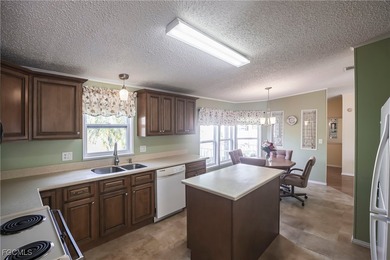 OWNED LAND- NO LEASEE INVOLVED Beautiful 2 Bedroom, 2 Bath home on Pine Lakes Country Club in Florida - for sale on GolfHomes.com, golf home, golf lot