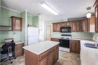OWNED LAND- NO LEASEE INVOLVED Beautiful 2 Bedroom, 2 Bath home on Pine Lakes Country Club in Florida - for sale on GolfHomes.com, golf home, golf lot