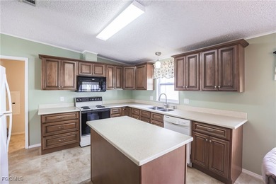 OWNED LAND- NO LEASEE INVOLVED Beautiful 2 Bedroom, 2 Bath home on Pine Lakes Country Club in Florida - for sale on GolfHomes.com, golf home, golf lot