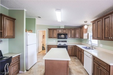OWNED LAND- NO LEASEE INVOLVED Beautiful 2 Bedroom, 2 Bath home on Pine Lakes Country Club in Florida - for sale on GolfHomes.com, golf home, golf lot