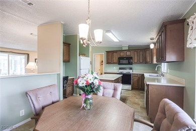OWNED LAND- NO LEASEE INVOLVED Beautiful 2 Bedroom, 2 Bath home on Pine Lakes Country Club in Florida - for sale on GolfHomes.com, golf home, golf lot