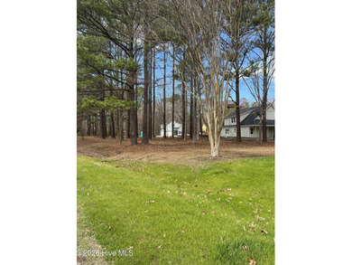 Corner wooded lot with mature trees offering privacy in a gated on Sound Golf Links at Albemarle Plantation in North Carolina - for sale on GolfHomes.com, golf home, golf lot