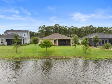 This breathtaking lakefront estate in Plantation Bay perfectly on Plantation Bay Golf and Country Club in Florida - for sale on GolfHomes.com, golf home, golf lot