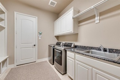 This stunning Traditional French-style Twin Oaks home in Las on Four Seasons Resort and Club in Texas - for sale on GolfHomes.com, golf home, golf lot