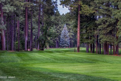 Situated on the 7th tee of Pinetop Lakes Country Club in the on Pinetop Lakes Golf and Country Club in Arizona - for sale on GolfHomes.com, golf home, golf lot