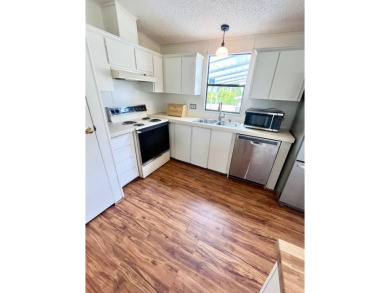 This 2-bedroom, 2-bathroom home is ready for new owners! on Lake Fairways Country Club in Florida - for sale on GolfHomes.com, golf home, golf lot