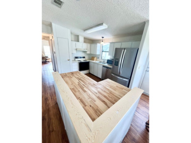 This 2-bedroom, 2-bathroom home is ready for new owners! on Lake Fairways Country Club in Florida - for sale on GolfHomes.com, golf home, golf lot
