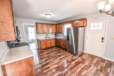 This gorgeous Cape Cod Colonial home is located in the heart of on Tri Cities Golf Club in Tennessee - for sale on GolfHomes.com, golf home, golf lot