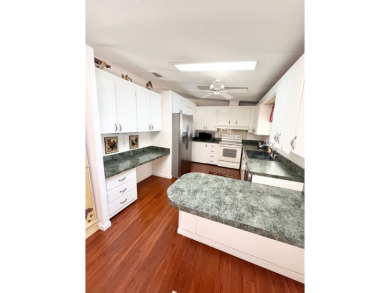 Enjoy water views from this beautiful 2-bedroom, 2-bathroom home on Lake Fairways Country Club in Florida - for sale on GolfHomes.com, golf home, golf lot