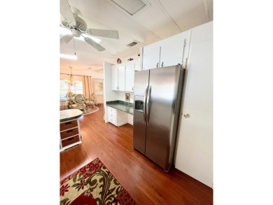 Enjoy water views from this beautiful 2-bedroom, 2-bathroom home on Lake Fairways Country Club in Florida - for sale on GolfHomes.com, golf home, golf lot