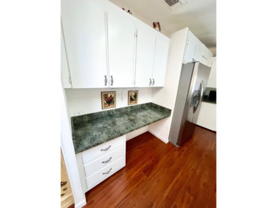 Enjoy water views from this beautiful 2-bedroom, 2-bathroom home on Lake Fairways Country Club in Florida - for sale on GolfHomes.com, golf home, golf lot