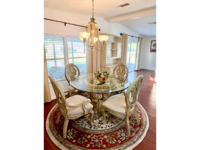 Enjoy water views from this beautiful 2-bedroom, 2-bathroom home on Lake Fairways Country Club in Florida - for sale on GolfHomes.com, golf home, golf lot