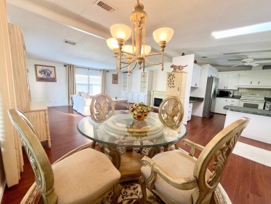 Enjoy water views from this beautiful 2-bedroom, 2-bathroom home on Lake Fairways Country Club in Florida - for sale on GolfHomes.com, golf home, golf lot