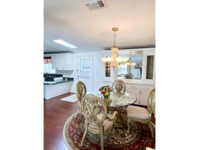 Enjoy water views from this beautiful 2-bedroom, 2-bathroom home on Lake Fairways Country Club in Florida - for sale on GolfHomes.com, golf home, golf lot