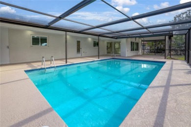 Under contract-accepting backup offers. Stunning Pool Home with on Rotonda Golf and Country Club The Hills Course in Florida - for sale on GolfHomes.com, golf home, golf lot