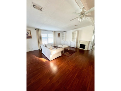 Enjoy water views from this beautiful 2-bedroom, 2-bathroom home on Lake Fairways Country Club in Florida - for sale on GolfHomes.com, golf home, golf lot