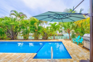 Fantastic 6 Bedroom, 4 Bath 3,248 sq. ft. waterfront pool home on Key Colony Beach Golf Course in Florida - for sale on GolfHomes.com, golf home, golf lot