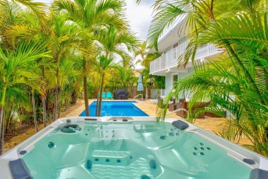 Fantastic 6 Bedroom, 4 Bath 3,248 sq. ft. waterfront pool home on Key Colony Beach Golf Course in Florida - for sale on GolfHomes.com, golf home, golf lot