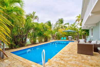 Fantastic 6 Bedroom, 4 Bath 3,248 sq. ft. waterfront pool home on Key Colony Beach Golf Course in Florida - for sale on GolfHomes.com, golf home, golf lot