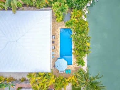 Fantastic 6 Bedroom, 4 Bath 3,248 sq. ft. waterfront pool home on Key Colony Beach Golf Course in Florida - for sale on GolfHomes.com, golf home, golf lot