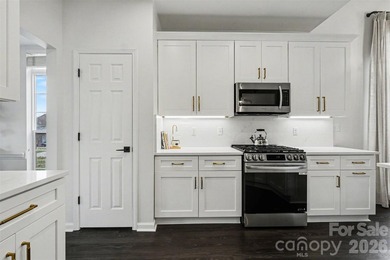 Set along the 4th tee of the golf course in the highly desirable on Highland Creek Golf Club in North Carolina - for sale on GolfHomes.com, golf home, golf lot