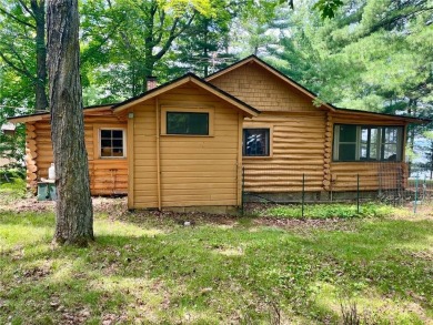 Step back in time with this charming, 100+ year-old seasonal log on Minnesota National Golf Course in Minnesota - for sale on GolfHomes.com, golf home, golf lot