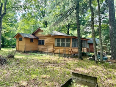 Step back in time with this charming, 100+ year-old seasonal log on Minnesota National Golf Course in Minnesota - for sale on GolfHomes.com, golf home, golf lot