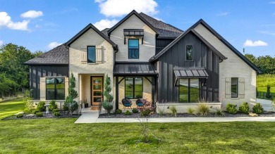 Completed in 2024, this 5 bedroom, 2 level waterfront home is on Sugar Tree Golf and Country Club in Texas - for sale on GolfHomes.com, golf home, golf lot