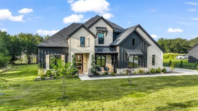 Completed in 2024, this 5 bedroom, 2 level waterfront home is on Sugar Tree Golf and Country Club in Texas - for sale on GolfHomes.com, golf home, golf lot