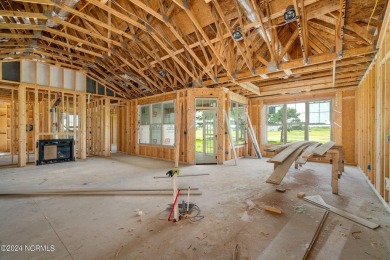 Walking into 211 Windswept Lane is like taking a deep breath and on North River Club in North Carolina - for sale on GolfHomes.com, golf home, golf lot