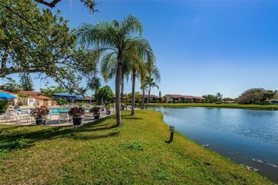AFFORDABLE ~ 55+ MAINTENANCE FREE ~ TROPICAL SETTING ~ EXCELLENT on Gulf Harbors Golf Course in Florida - for sale on GolfHomes.com, golf home, golf lot