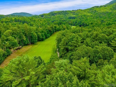 This .75 acre gently sloping golf course lot overlooks #3 green on Lake Toxaway Country Club in North Carolina - for sale on GolfHomes.com, golf home, golf lot
