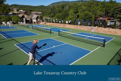 This .75 acre gently sloping golf course lot overlooks #3 green on Lake Toxaway Country Club in North Carolina - for sale on GolfHomes.com, golf home, golf lot