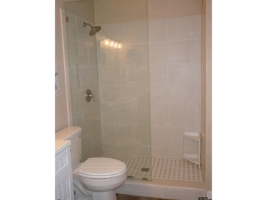 Totally and very tastefully remodeled this home is the on Holly Lake Ranch Golf Club in Texas - for sale on GolfHomes.com, golf home, golf lot