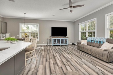 Welcome to this stunning 2,887-square-foot home that perfectly on Oak Grove Island Golf and Country Club in Georgia - for sale on GolfHomes.com, golf home, golf lot