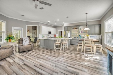 Welcome to this stunning 2,887-square-foot home that perfectly on Oak Grove Island Golf and Country Club in Georgia - for sale on GolfHomes.com, golf home, golf lot